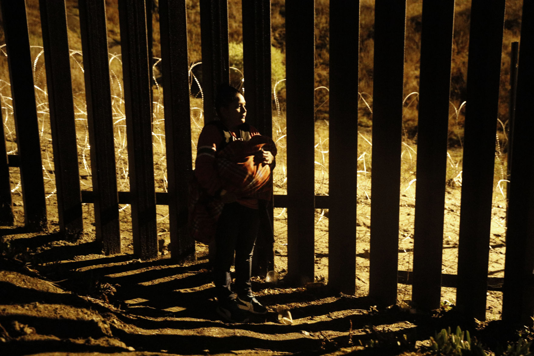 Central America Migrant Caravan - Jumping the Wall Photo Gallery